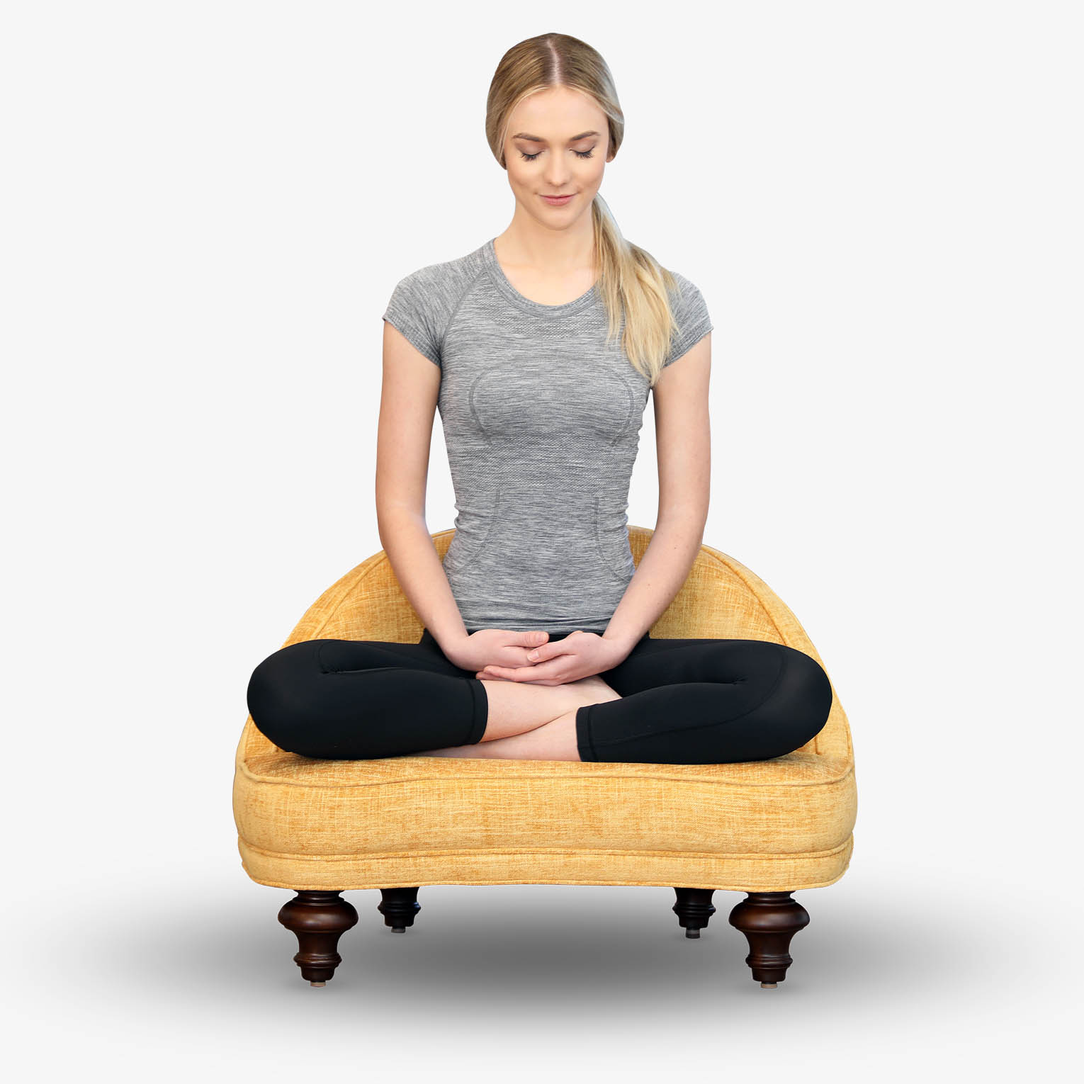 Woman in full lotus meditating on The Anahata Chair