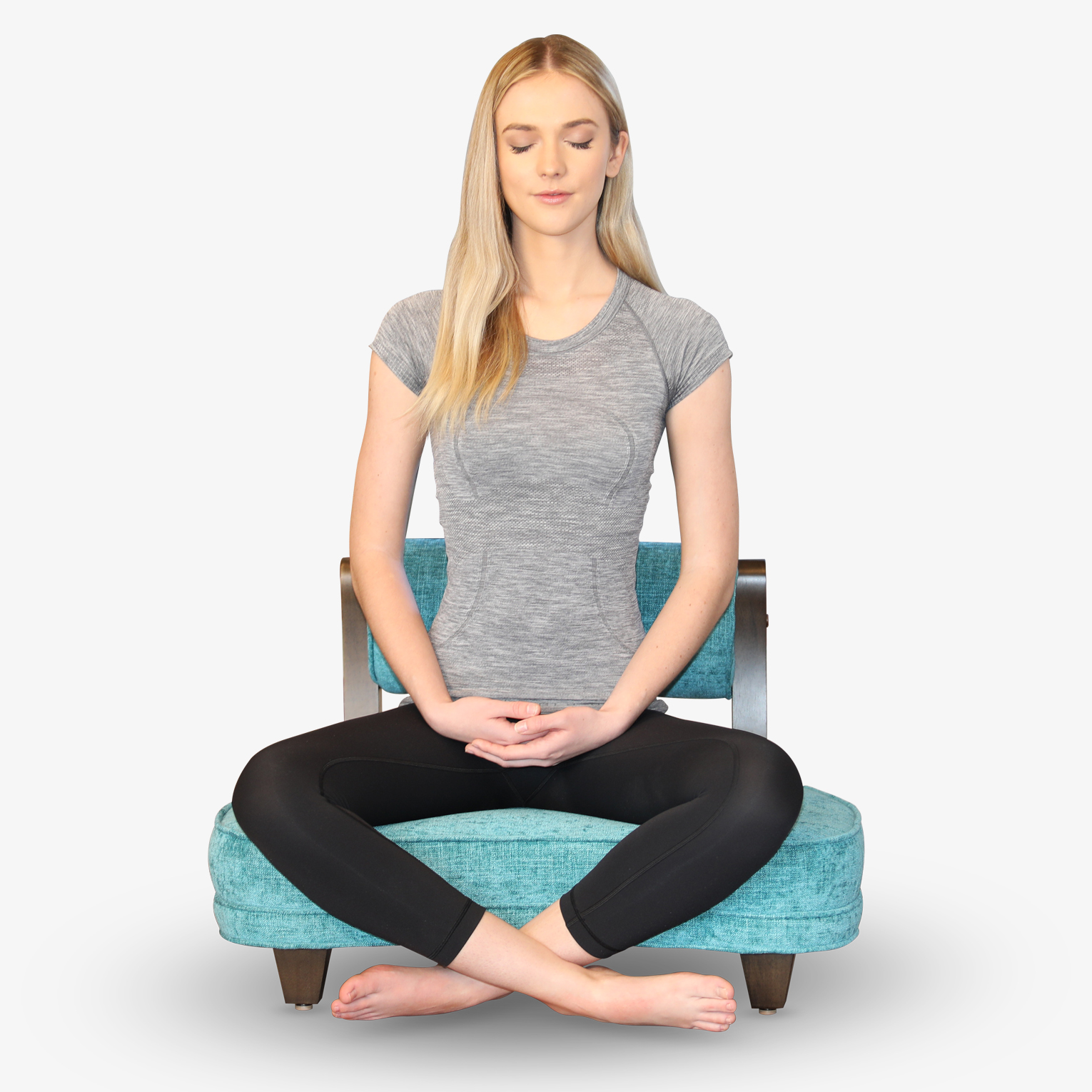 A woman meditating in The Rama Meditation Chair